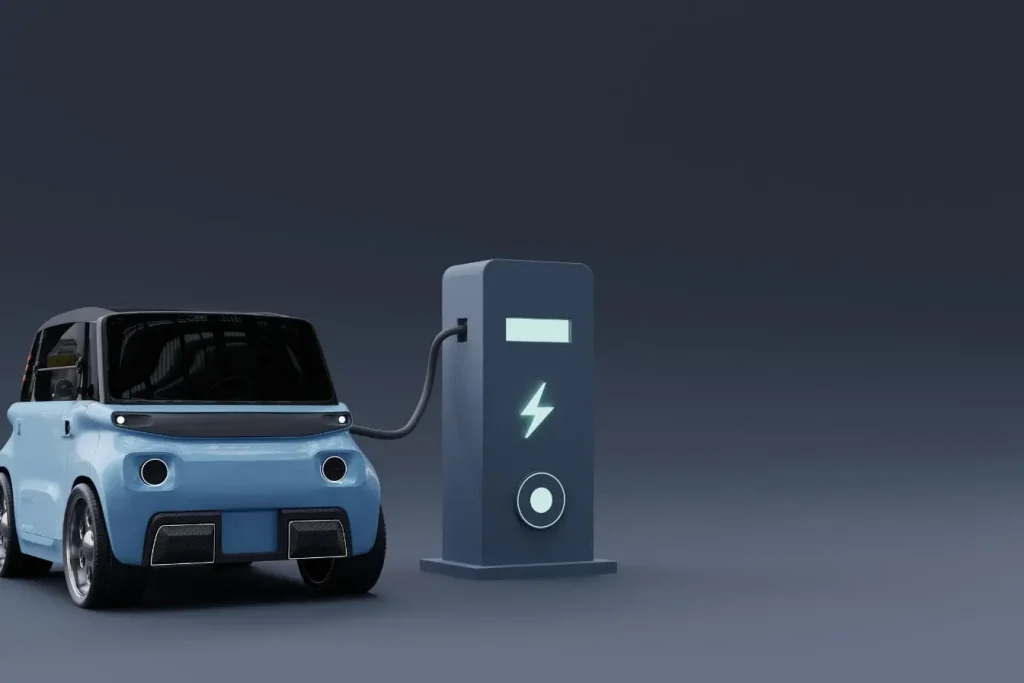 Mobilize Duo compacte en cours de recharge sur fond futuriste, image d’une micro-citadine électrique moderne